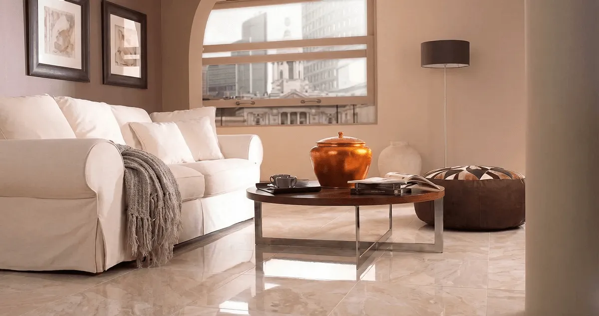 Modern living room with professionally installed marble flooring, a beige sofa, coffee table in Naperville, IL
