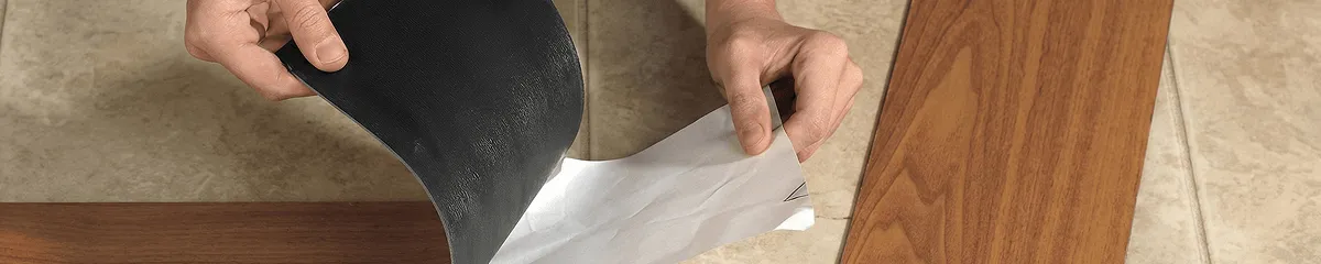 A professional installing vinyl flooring in Naperville, IL